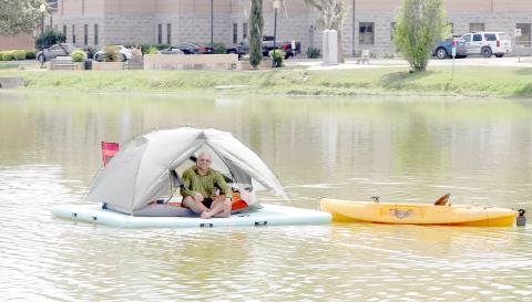 Michael McInally, a Lake City man who has an outdoors YouTube channel, is spending 24 hours floating on Lake DeSoto in downtown Lake City. (TONY BRITT/Lake City Reporter)