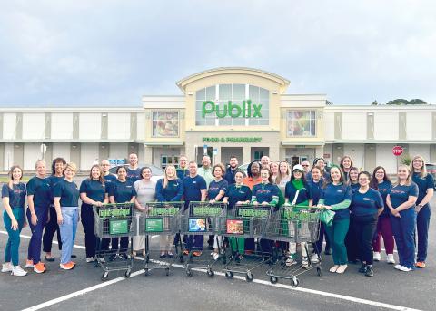 HCA Florida Lake City Hospital colleagues shopped for nonperishable food items to donate to Love INC. (COURTESY)