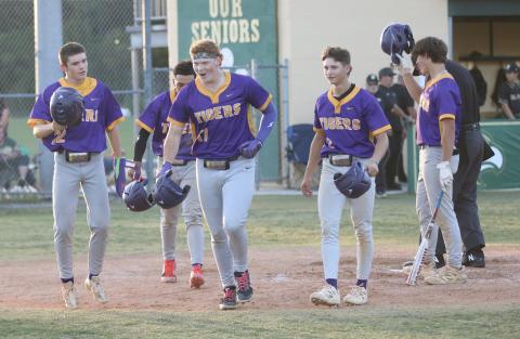 Columbia first baseman Nolan Slaymaker (17) runs back to the dugout with a smile on his face after hitting a grand slam that drove in Nate Stapleton (22), Abraham Martinez (back) and Madden Mann (2) during the first inning of the Tigers’ 6-2 win over Fleming Island in the District 3-5A championship on Thursday. (JORDAN KROEGER/Lake City Reporter)