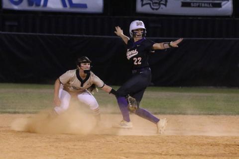 Columbia catcher Emily Delgado (22) signals she's safe at second base ahead of the tag from Buchholz second baseman Avery Fullam during Thursday's 4-2 win. (MORGAN MCMULLEN/Lake City Reporter) 