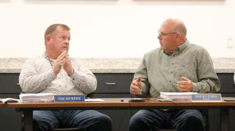Columbia County Commissioners and North Florida Water Utilities Authority members Tim Murphy and Rocky Ford argue on the county’s sale of the sewer plant at the North Florida Mega Industrial Park to the City of Lake City during the board’s Monday meeting. (JAMIE WACHTER/Lake City Reporter)