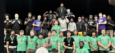 District 3-2A traditional champion Columbia and runner-up Suwannee show off their trophies and medals on Saturday. (COURTESY)