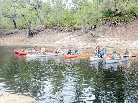 Teams get ready for the canoe race as part of Tri County Day on Saturday at Wayside Park in White Springs. (COURTESY)