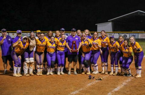 Columbia poses with the District 3-4A championship trophy after defeating Baker County 7-4 on Thursday. (BRENT KUYKENDALL/Lake City Reporter)