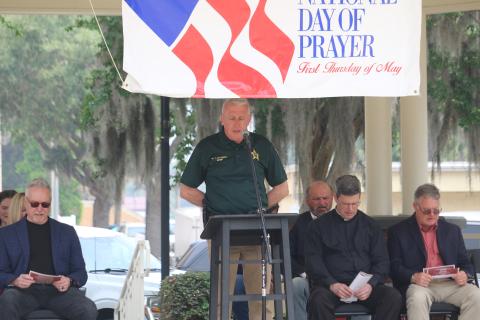 Columbia County Sheriff Wallace Kitchings recites the Lord’s Prayer at the National Day of Prayer observance in Olustee Park on Thursday. (TONY BRITT/Lake City Reporter)
