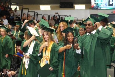 Florida Gateway College students turn their tassels after graduating on Friday morning. (TONY BRITT/Lake City Reporter)