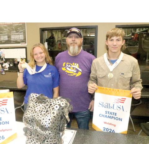 Columbia High School welding students Ruby Chandler (left) and Mason Dusen (right) are competing at the national SkillsUSA competition in Atlanta next week. They are joined by CHS welding instructor Darryl Thomas. (TONY BRITT/Lake City Reporter)