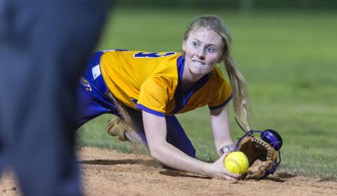 Columbia second baseman Anna Dansby, a four-year starter, dives to field a ground ball during the Region 1-4A championship against Baker County on May 14. (JACK HOWDESHELL/Lake City Reporter)