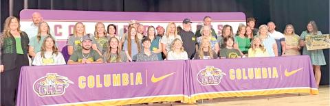 Eight Columbia High seniors — Calvin Sullivan, Casen Maddox, Ava Christie, Kali Kennington, Adyson Vercher, Griffin Roberts, Shelby Minton and Allie Brush — are joined by family as they are honored for planning to continue their education at Florida Gateway College. (COURTESY)
