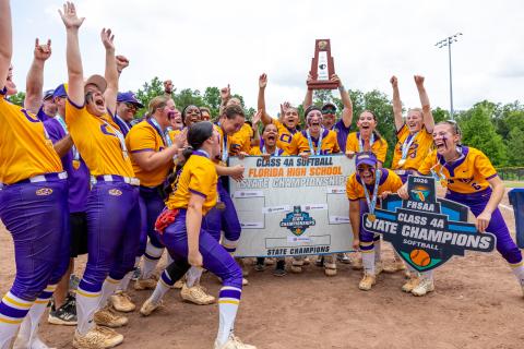 Columbia's softball team celebrates after Ryleigh Stone (77) advanced the Tigers on the Class 4A Final Four bracket following their 3-2 win over Lake Wales in the Class 4A state championship on Saturday. (JACK HOWDESHELL/Lake City Reporter)