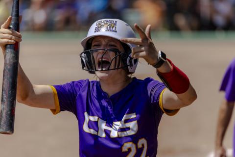 Columbia catcher Emily Delgado encourages the CHS student section to get up for her team after scoring a run following her RBI double in the seventh inning of Thursday's Class 4A state semifinal against Seminole. (JACK HOWDESHELL/Lake City Reporter)