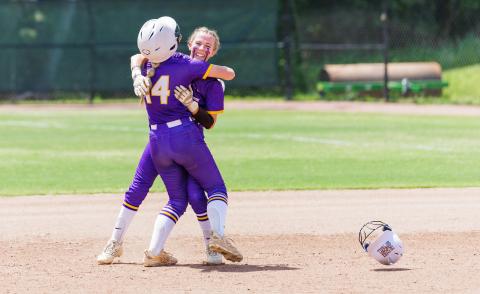Columbia right fielder Marlee Hunt (14) hugs left fielder Addyson Sherman after Sherman hit a walk-off RBI single to defeat Seminole 6-5 in the Class 4A state semifinals on Thursday. (JACK HOWDESHELL/Lake City Reporter)