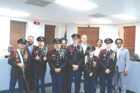 Members of the Columbia High School JROTC program pose with members of the Lake City Council during Monday’s meeting. (MORGAN MCMULLEN/Lake City Reporter)