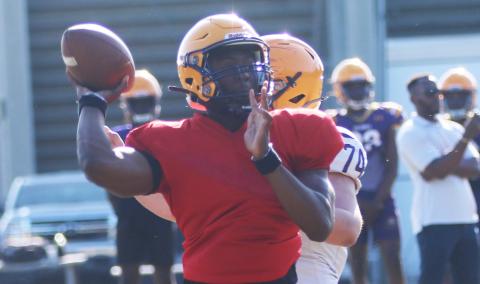 Former Columbia quarterback Xavier Collins throws a pass during spring practice on April 29. Collins departed after practice Tuesday to transfer to Camden County in Georgia. (JORDAN KROEGER/Lake City Reporter)