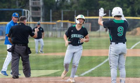 Suwannee first baseman Grayson Greene (19) is greeted at home plate by catcher Jace Moran (9) as he scores a run during Game 1 of the Region 1-3A semifinals on Friday. (ASHLEY CHANDLER/News-Leader)