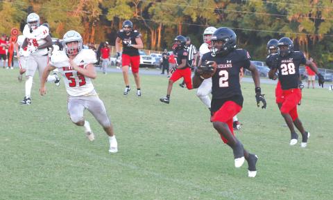 Fort White defensive back Marvion Wallace (2) takes his second interception of the night into Williston territory during Friday’s spring game. (MORGAN MCMULLEN/Lake City Reporter)