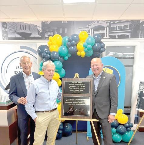 First Federal President and CEO John Medina (right) is joined by former First Federal CEO Keith Leibfried (left) and Johnny Flood, the son of previous CEO John Flood as the bank dedicated its main Live Oak branch to John Flood. (COURTESY)
