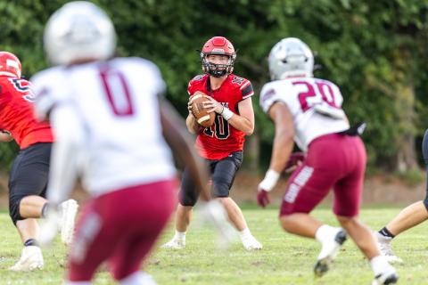 Lafayette quarterback Tucker Higginbotham drops back to pass against Madison County during the teams' spring game on Tuesday. (JACK HOWDESHELL/Lake City Reporter)