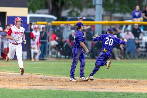 Union County shortstop Wesley Crockett (20) fields the ground ball up the middle in the bottom of the eighth inning and steps on second base for the force out on Garrett Taylor (9) to end the Game 2 of the Region 3-R finals. It finished off a sweep for the Tigers. (JACK HOWDESHELL/Lake City Reporter)