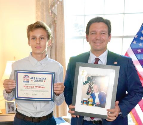 Fort White Middle School student Maverick Williams won a state essay contest on ‘Celebrating Florida’s Contributions to America’ for his entry on Dr. James Cade, the founder of Gatorade. Williams won a two-year scholarship as well as a picture of Cade from Gov. Ron DeSantis in the contest. (COURTESY)