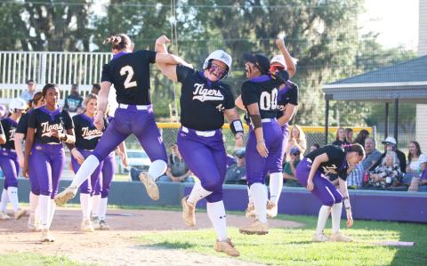 Columbia third baseman Josie Raulerson celebrates with teammates after hitting a solo home run against Arnold in the Region 1-4A semifinals on Wednesday. (JORDAN KROEGER/Lake City Reporter)