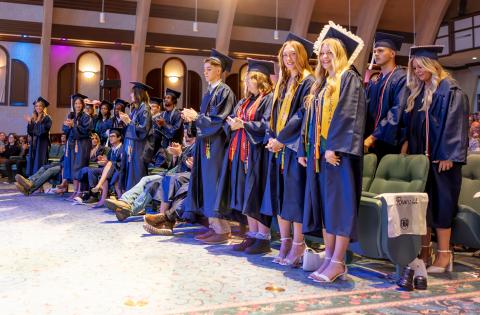 Belmont Academy valedictorian Chelsie Johnson (right) and salutatorian Jenavieve Farer stand with fellow graduates during Saturday’s commencement ceremony. (RAY CARPENTER/Lake City Reporter)