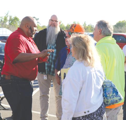 State Sen. Corey Simon (left) speaks with Water First North Florida meeting attendees outside the UF/IFAS North Florida Research and Education Center Suwannee Valley’s educational pavilion in March. (FILE)