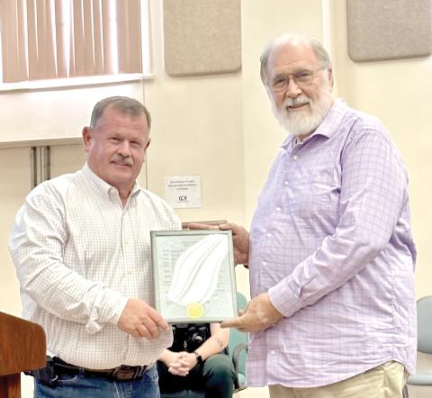 Columbia County Commission Chairman Tim Murphy (left) presents a proclamation declaring June 21-27 as Amateur Radio Week to Brad Swartz, the local Amateur Radio Emergency Services coordinator, at last week’s commission meeting. (COURTESY)
