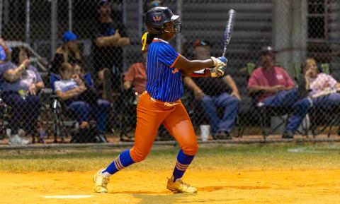Branford first baseman Mallory Blue watches her home run soar over the fence against Fort White during the District 6-R semifinals on April 28. (JACK HOWDESHELL/Lake City Reporter)