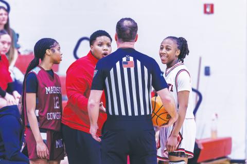 Fort White coach Bregay Harris questions a call to a referee while guard Javiona Roberson (right) smiles during the Region 3-R semifinals against Madison County on Feb. 13. (FILE)