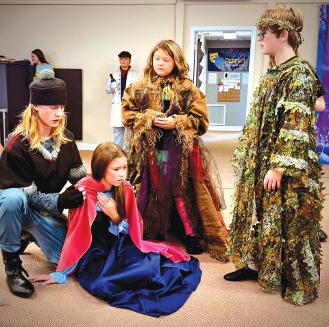 Abram Webb (from left) as Kristoff, Ainzli Kenney as Anna, Chatlynn Childs as Bulda, and Emery Webb as Pabbie rehearse a scene for the upcoming Practically Perfect Performing Arts production of ‘Frozen Jr.’ (COURTESY)
