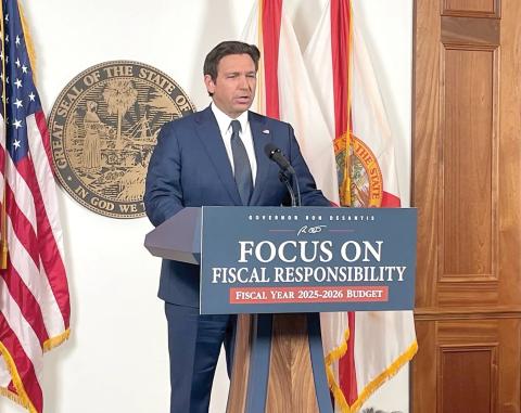 Gov. Ron DeSantis, shown releasing his proposed budget, signed the budget Monday, vetoing more than $800 million from the $117.6 billion plan. (NEWS SERVICE OF FLORIDA FILE)