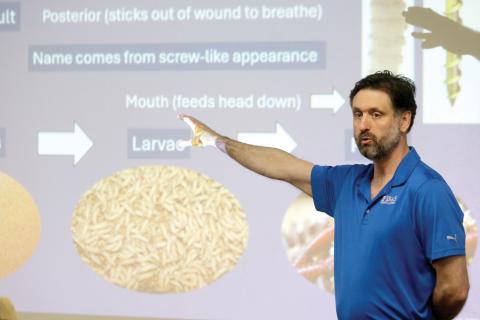 Dr. Edwin Burgess, an UF/IFAS veterinarian entomologist, speaks about the New Worl screwworm during a meeting Thursday night with local residents and farmers. (TONY BRITT/Lake City Reporter)