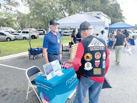 A veteran visits the Pinnacle Home Care table at last week’s Freedom 250 Veterans Fest at the Lake City VA Medical Center. (COURTESY)