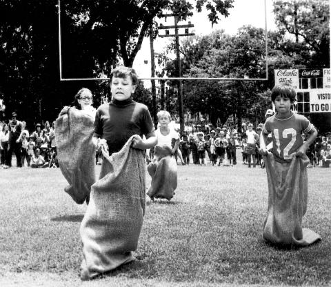 Children take part in a sack race at Memorial Stadium as part of Columbia County and Lake City’s Bicentennial celebration in 1976. (FILE)