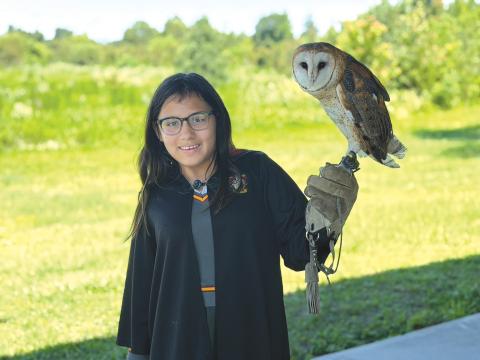 Lily Weaver gets the opportunity to hold an owl during the Columbia County 4-H Year Two session of the School of Life Skills for Magical Beings camp from June 22-26. (COURTESY COLUMBIA COUNTY 4-H)