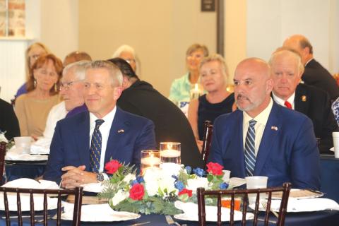 Former Florida Speaker of the House and gubernatorial candidate Paul Renner (left) and Chief Financial Officer Blaise Ingoglia listen during Thusday’s Lincoln/Reagan Dinner fundraiser. (TONY BRITT/Lake City Reporter)