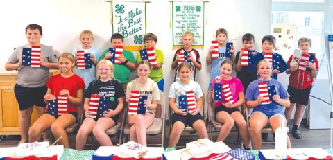 Lafayette County 4-H Camp USA campers display their patriotic crafts. Campers were able to learn about the rights, responsibilities and opportunities that come with being an American citizen. (COURTESY LAFAYETTE COUNTY 4-H)