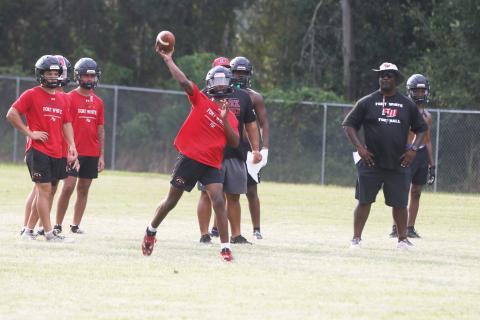 Fort White quarterback Chance Johnson throws a pass during Monday’s practice. (MORGAN MCMULLEN/Lake City Reporter)