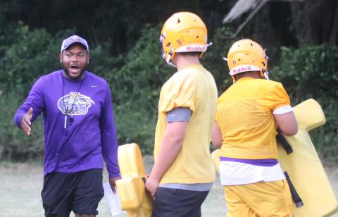 Columbia offensive line coach Anthony Newton works with his offensive line during Monday’s practice. Newton has taken over for David May, who departed after just one spring in the job. (JORDAN KROEGER/Lake City Reporter)