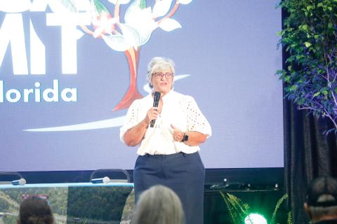 Lorie Vincent, the president of Acceleration by design LLC, the consulting firm that hosts Stand Up Rural America, opened the summit Tuesday at the Howard Center. (JAMIE WACHTER/Lake City Reporter)