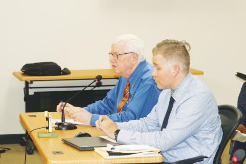 Henry Thomas and Matthew Ori of Faftelis Financial Consultants walk North Florida Water Utilities Authority board members through a series of rate increases during Monday’s meeting. (TONY BRITT/Lake City Reporter)