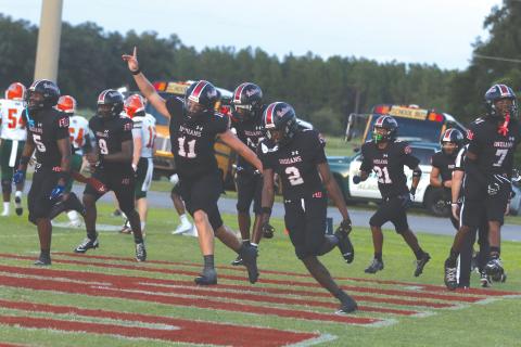 Fort White safety Marvion Wallace (2) celebrates with his teammates after his first interception return for a touchdown against Eastside on Friday. (MORGAN MCMULLEN/Lake City Reporter)