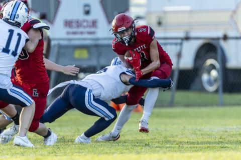 Lafayette receiver Lane O’Steen (3) reacts to the hit by a Maclay defensive back on Friday. (JACK HOWDESHELL/Lake City Reporter)
