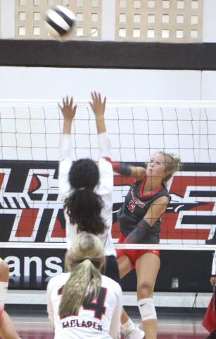 Lafayette outside hitter Havyn Richardson (5) fires a shot over the block of Fort White's Shaylee Lindsey during the Hornets' 3-1 win over the Indians. (MORGAN MCMULLEN/Lake City Reporter)