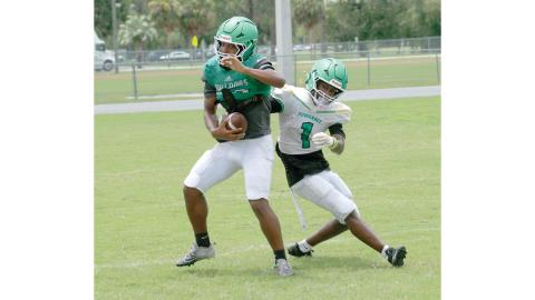 Suwannee safety Josh Johnson intercepts a pass in front of receiver Jamarcus Cherry during practice on Aug. 3. (JAMIE WACHTER/Lake City Reporter)