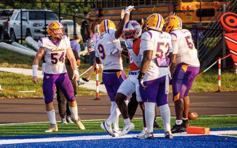 Columbia right tackle Xander Satterfield celebrates with teammates after scoring a touchdown against Bolles on Friday. (JAMARION WEST/Special to the Reporter)