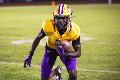 Columbia receiver Kyren Caldwell turns upfield after a catch against Riverside last Friday. (BRENT KUYKENDALL/Lake City Reporter)