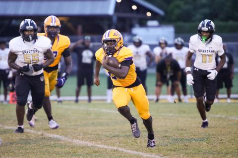 Columbia running back Jerome Horne gets around the corner of the Lakewood defense for a gain on Friday. (BRENT KUYKENDALL/Lake City Reporter)