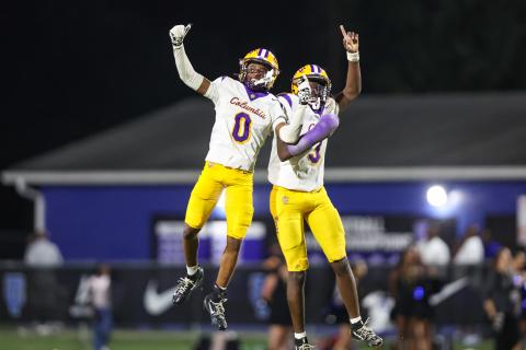 Columbia defensive back Mekah Combs-Turner (0) celebrates with defensive back Monterrence Williamson after one of his two turnovers against Trinity Christian on Friday. (GARY LLOYD MCCULLOUGH/Special to the Reporter)